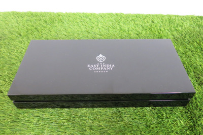 The East India Company Black Gloss Coin Box with Velvet Interior & 9 Coin Slot Tray. Comes with Original Box.