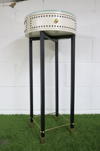 Cream Circular Side Table with Glass Top, Black Legs & Gold Hardware.
