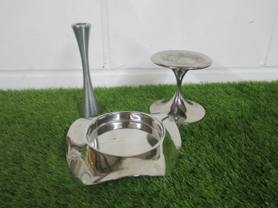 3 x Robert Welch Stainless Steel Pieces to Include: 1 x Candle Stick Holder, 1 x Drift Wine Bottle Coaster & 1 x Large Candle Stick Holder.