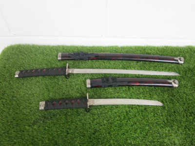 Pair of Japanese Samurai Swords. NOTE: damage to scabbard.