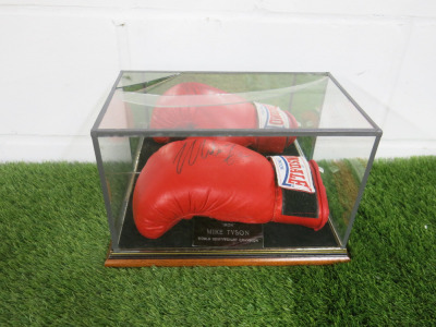 "Iron" Mike Tyson Signed Lonsdale Boxing Glove, in Perspex Display. NOTE: display requires repair.
