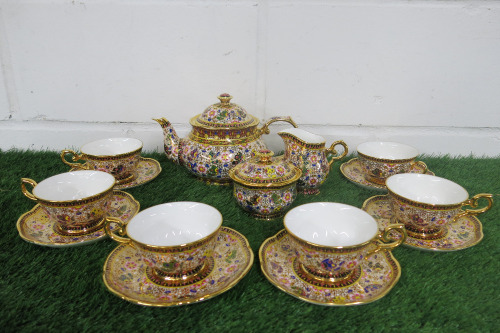Lot of The East India Company Royal Bone China Banjarong 18ct Gold Hand Painted Crockery to Include: 1 Tea Pot, 6 x Cups with Saucers, 1 x Milk Jug & 1 x Sugar Bowl.