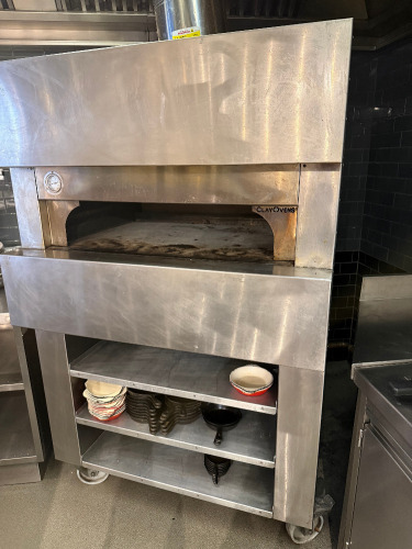 Clayburn, Clayoven Stone Based Gas Pizza Oven on Castors with 3 Shelves Under, Comes with 3 x Pizza Peels. Size H180 x W114 x D94cm.