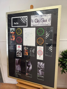 Gio Goi 'It Is What It Is" Framed & Glazed Collage of Promotional Materials & Letter. Size H118 x W88cm.