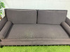 Dark Grey/Purple Upholstered Sofa with Bolster Cushions & Metallic Stud Detail on Black Wooden Leg Base. Size H78 x W210 x D90cm. - 3