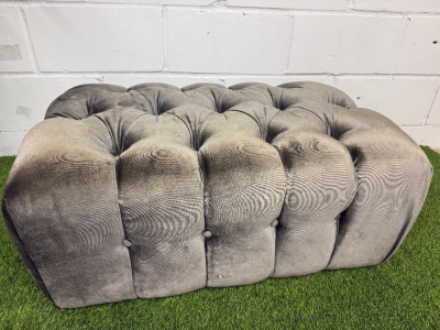 Crushed Grey Velour Upholstered Pouffe/Footstool with Button Detail. Size H38 x W83 x D50cm.