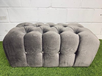 Crushed Grey Velour Upholstered Pouffe/Footstool with Button Detail. Size H38 x W83 x D50cm.