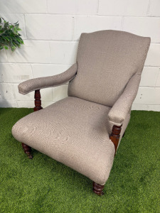 Traditional English Style Country House Upholstered Armchair on Brass Castors with Neutral Beige Fabric.