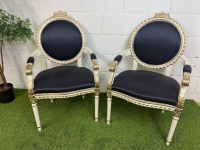 Pair of Louis XVI Style Carved Gilt Armchairs in White with Gold Painted Detail & Royal Blue Satin Upholstery with Three Rose Finial to Top.