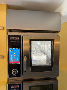 2 x Rational iCombi Pro 6 Grid Electric Combination Ovens, Model LM100AE.AXAXX, S/N E60SJ21042883688, E60SJ21042883684, YOM 2021, 3 Phase. Comes with Rational Ultra Vent E Combi Duo, Model UV Plus XS 6 2/3, S/N DT3PA21045047270, Stainless Steel Mobile St