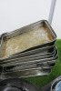 Lot of Kitchen Accessories to Include: 3 x Frying Pans, 3 x Woks, 9 x Metal Trays, 6 x Sieves, 1 x Steamer, 1 x Batter Dispenser, 1 x Funnel & 4 x Small Buckets. - 2