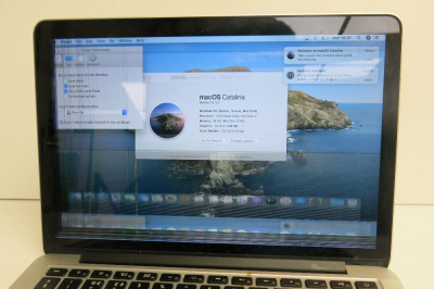 Apple MacBook Pro. NOTE: damaged screen & mouse pad.