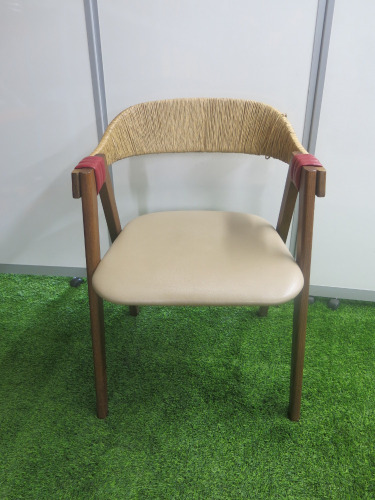 Designer Patricia Urquiolas Mathilda Chair for Moroso. Curved Plywood Backrest Encased in Woven Rush.