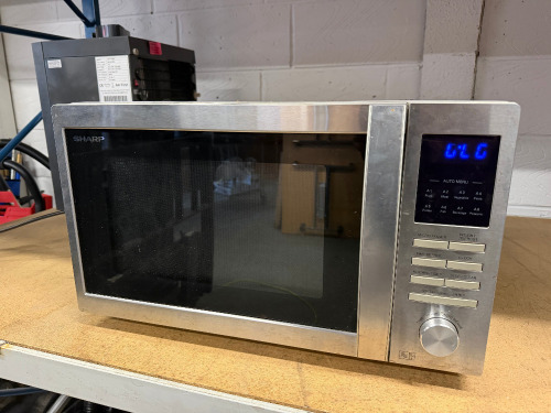 Sharp Chrome Microwave Oven, Model R-322STM.