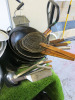 Large Quantity of Commercial Kitchen Accessories to Include: 6 x Metal Collanders, 30 x Assorted Metal GN Containers, 20 x Assorted Sized GN Lids, 2 x Metal Cooking Trays, 3 x Skillet Pans, 6 x Woks, 8 x Assorted Sized Baskets, 4 x Metal Measuring Jugs, 1 - 3