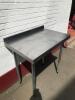 2 x Vogue Stainless Steel Prep Tables with Corner Joiner. Size H90cm x W 170cm x 170cm x D60cm, with Back Splash Upstand. - 8