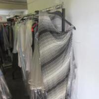 Cloth Rail Containing 50 x Assorted Items of Clothing Including Dresses, Skirts & Jackets (As Viewed)