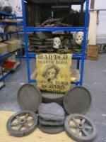 Rack Containing Assorted Pirate Stage Props to Include: 4 x Small Treasure Chests, 3 x Replica Flintlock Guns, Approx 20 x Pully Blocks, 2 x Wanted Posters, 2 x Cart Wheels & Imitation Barrel with Lids (As Viewed)