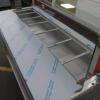 New/Unused (Manufactured July 2017) TFSE Products Ltd, Café Counter Heated Wet Well Bain Marie Servery. Model SM1750-740BM.Quartz Heat Lit Gantry with Toughened Glass Screen Top, Front & Sides. Stainless Steel Construction with Red Laminate Fascia. Size H - 11