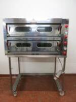 Italforni Pesaro Twin Deck Pizza Oven, Model TKD-21, S/N 51409, DOM 2019, 3 Phase.Each Deck is Thermostatically Controlled Upto 450cc.Size H70cm x W124cm x D94cm.Overall Height 165cm with Stand.Comes with Mobile Pizza Oven Stand, 2 x Pizza Lifters & Instr