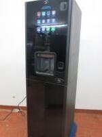 AZKYOEN Coffee Vending Machine, Model ZEN, S/n 10163873. Comes on Metal Base Cabinet with Water Filter. NOTE: no key & requires new plug.