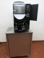 Aequator Swiss Made Commercial Bean to Cup Coffee Machine on Stainless Steel Mobile Cabinet. Model Brasil GB/High Gloss Black, S/N 220509024. Fitted with CURRENZA C-B6M-F-GBP/EUR. Comes with Key & Water Softener.
