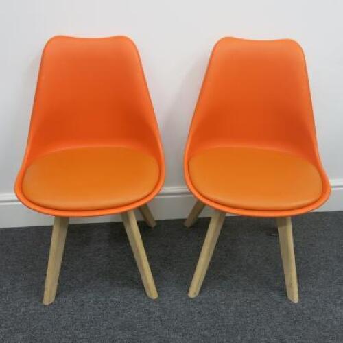 Pair of Habitat Jerry 120858 Dining Chairs in Molded Plastic with an Upholstered Seat Pad and Solid Oak Legs. Colour Orange