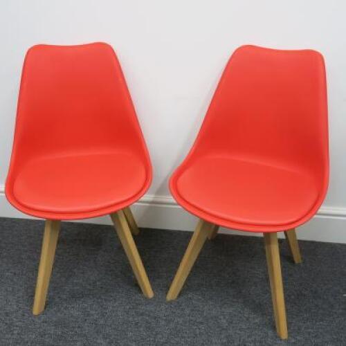 Pair of Habitat Jerry 120858 Dining Chairs in Molded Plastic with an Upholstered Seat Pad and Solid Oak Legs. Colour Red