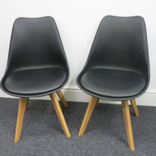 Pair of Habitat Jerry 120858 Dining Chairs in Molded Plastic with an Upholstered Seat Pad and Solid Oak Legs. Colour Black