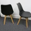 Pair of Habitat Jerry 120858 Dining Chairs in Molded Plastic with an Upholstered Seat Pad and Solid Oak Legs. Colour Black - 3