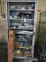 Cabinet Containing Approx 30 x Assorted Car Parts to Include: Steering Racks, Light Surrounds, Chrome Steering Column (New/Boxed), Brake Drums, Front Discs & Other Parts: NOTE: parts believed to be Ford Mustang but not guaranteed.