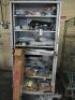 Cabinet Containing Approx 30 x Assorted Car Parts to Include: Steering Racks, Light Surrounds, Chrome Steering Column (New/Boxed), Brake Drums, Front Discs & Other Parts: NOTE: parts believed to be Ford Mustang but not guaranteed.