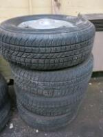 4 x Steel Rimmed Tyres & Hubcaps 235/75/R15 .