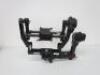 DJI Ronin Hand Held Camera Stabilization System to Include: 1 x Gimbal Model R-16, S/N 0330039382, 1 x Top Handle Bar, 1 x Turning Stand, 1 x Remote Control Model NDJ6, 1 x Camera Mounting Plate, 2 x Adjustable Extension Rod, 1 x Charger, 2 x Quick Releas - 9
