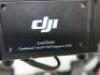 DJI Ronin Hand Held Camera Stabilization System to Include: 1 x Gimbal Model R-16, S/N 0330039382, 1 x Top Handle Bar, 1 x Turning Stand, 1 x Remote Control Model NDJ6, 1 x Camera Mounting Plate, 2 x Adjustable Extension Rod, 1 x Charger, 2 x Quick Releas - 10