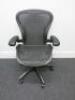 Herman Miller Aeron Ergonomic Adjustable Mesh Office Chairwith Adjustable Arm Rests & Vinyl Arm Caps.Size B.NOTE: seat pan requires refurbishment (As Viewed/Pictured).&nbsp;