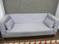 3 Seater Sofa Upholstered in Light Grey Fabric with 2 Cushions, Button Back & Stud Detail on Black Wooden Legs. Size H83cm x W200cm x D85cm.