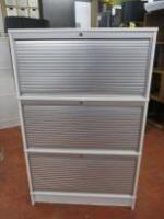 3 Tier Roller Shutter Cabinet in White. Size H135cm x W85cm x D43cm. Comes with 15 Perspex Paper Trays & Key.