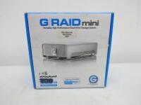 G- Technology 1TB G Raid Mini External Hard Drive. Comes with Power Supply, Assorted Cables, Protective Carry Case & Box.