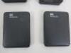8 x Assorted Portable External Hard Drives to Include: 2 x WD Elements 500GB, 1 x WD My Passport 1TB, 1 x WD 500GB, 1 x Verbatim 320GB, 1 x Toshiba 1TB, 1 x Fujitsu 200GB & 1 x Viasat 500GB. - 3