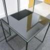 Set of 3 Black Assorted Sized Metal Framed Display Tables with Black Glass Insert to Include 2 x H65cm x W43cm x D43cm & 1 x H45cm x W43cm x D43cm. - 3