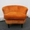 Burnt Orange Upholstered Lounge Chair on Black Legs. H69cm x W80cm x D69cm.