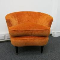 Burnt Orange Upholstered Lounge Chair on Black Legs. H69cm x W80cm x D69cm.