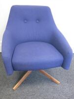 Montis Low Swivel Chair, Upholstered in Divina MD Blue Fabric with Button Back Detail. Size (H)90cm x (W)75cm.