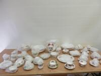 57 x Items of Assorted Paragon Fine Bone China (Patterns: Rockingham, Symmetra, Majestic, Bridesmaid) to Include: 1 x Tea Pot, 2 x Coffee Pots, 2 x Serving Dishes, 5 x Milk Jugs, 3 x Sugar Bowls, 7 x Side Plates, 1 x Serving Plate, 14 x Cups & Saucers & 4