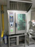 Rational 10 Rack Self Cooking Centre, Model SCC 101, S/N E11SE08062145501. Comes with S/S Extraction Unit, Model UV61101E & 14 Shelf Stainless Steel Base.