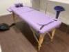 Fold Out Massage Table on Wooden Frame with Faux Purple Leather Top in Carry Case.