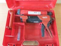 Hilti Manual Adhesive Dispenser, Model HDM 330. Comes with Operating Instructions, 1 Wire Brush and Carry Case.