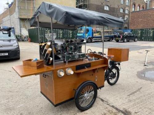 Coffee Bike Point of Sale, Electric Tricycle in Wood with Fold Out Shelf & Canopy. Consisting of Francino 2 Group LPG Coffee Machine, S/N 286411016 (2016) with Francino Coffee Grinder, Cup Dispenser, Knock Box, Cash Drawer, Sink & Tap. Fitted Battery & In