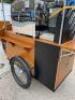 Coffee Bike Point of Sale, Electric Tricycle in Wood with Fold Out Shelf & Canopy. Consisting of Francino 2 Group LPG Coffee Machine, S/N 286411016 (2016) with Francino Coffee Grinder, Cup Dispenser, Knock Box, Cash Drawer, Sink & Tap. Fitted Battery & In - 20